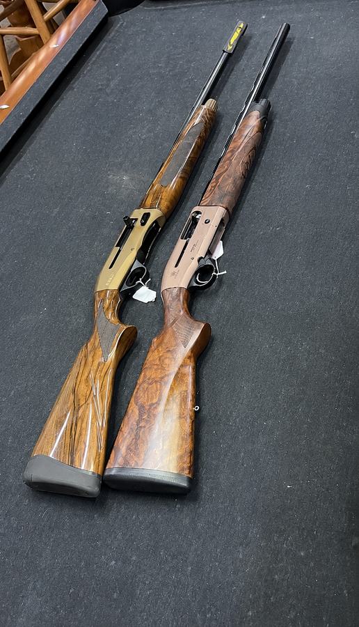 A pair of 12 gauge semi-automatic shotguns available as rentals for guests